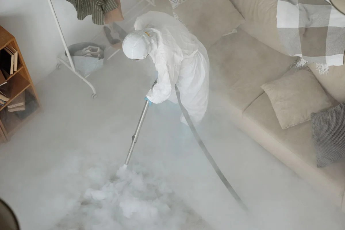 Biohazard cleanup technician in protective equipment, Seneca, MO